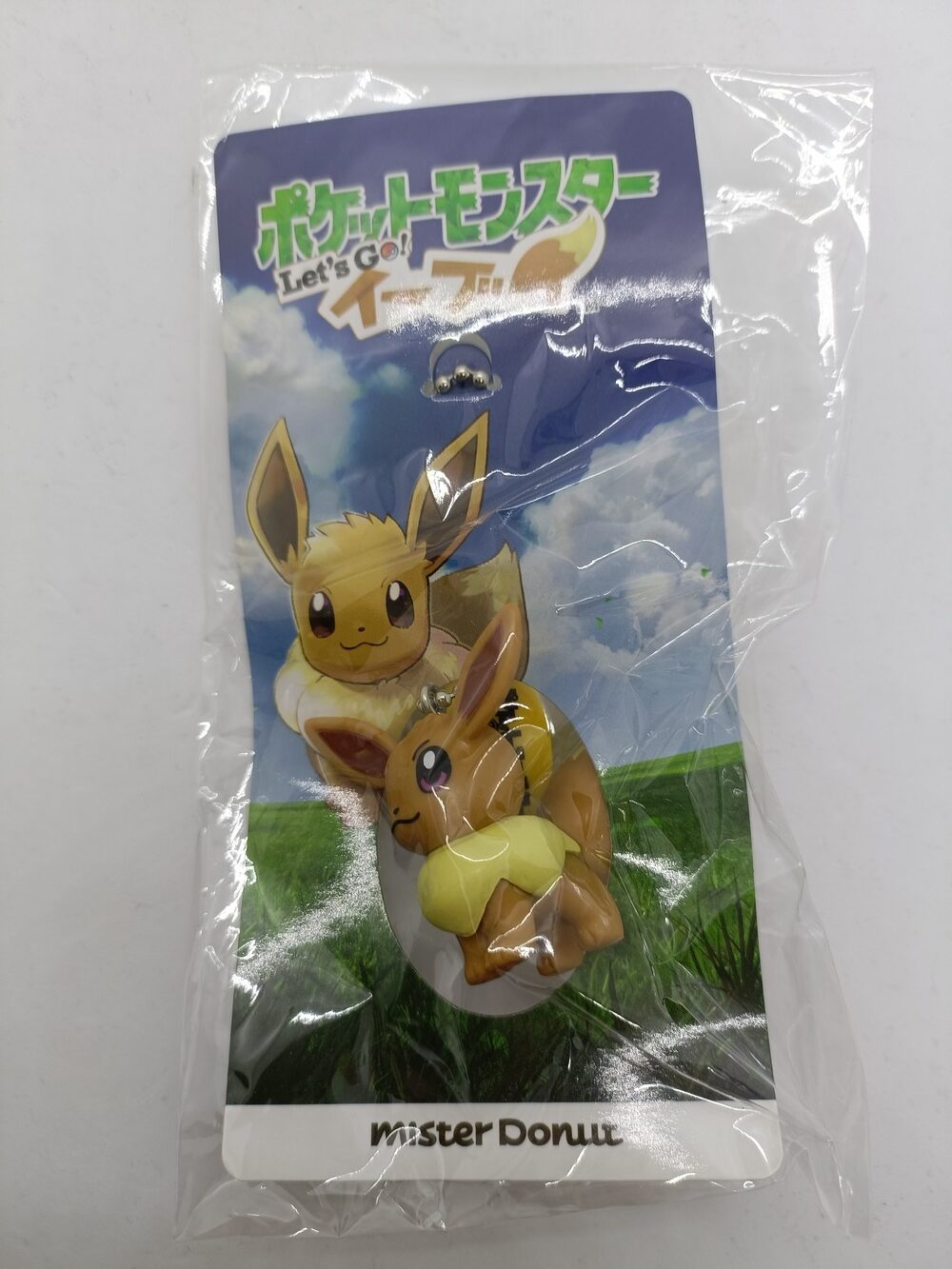 Pokemon: Let's Go Eevee: Eevee - avaimenperä (Mister Donut, suu kiinni) Kunto: A/S